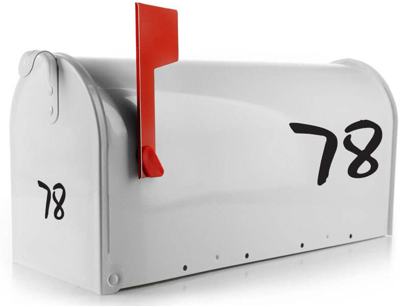 Custom vinyl mailbox numbers in bold font on a white mailbox
