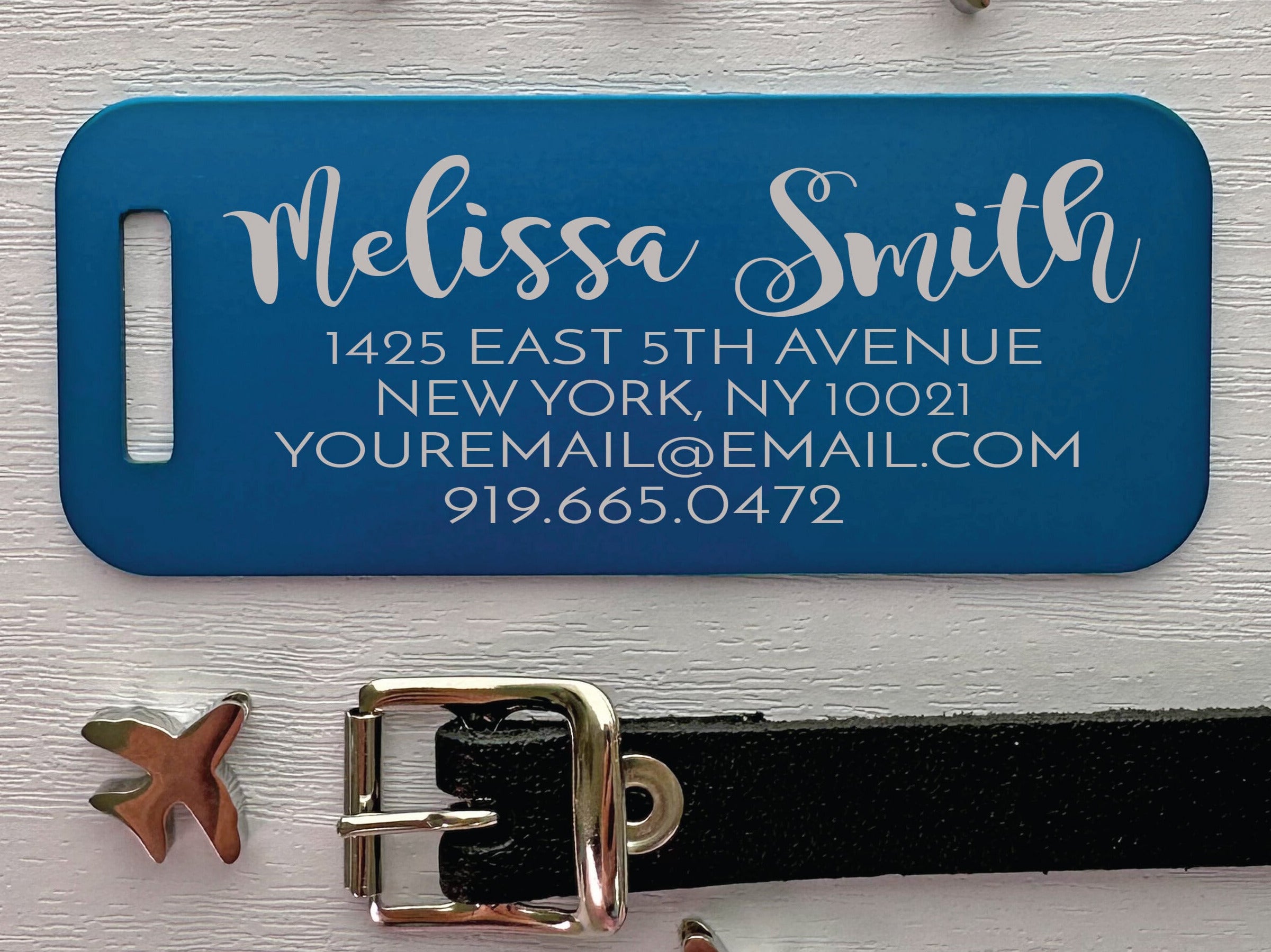 Blue personalized luggage tag with engraved metal nameplate for secure bag identification