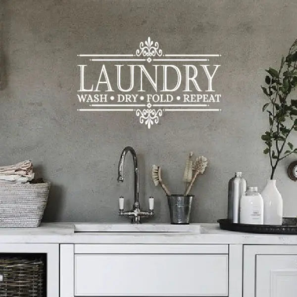 Wash dry fold repeat wall art in farmhouse-style laundry space
