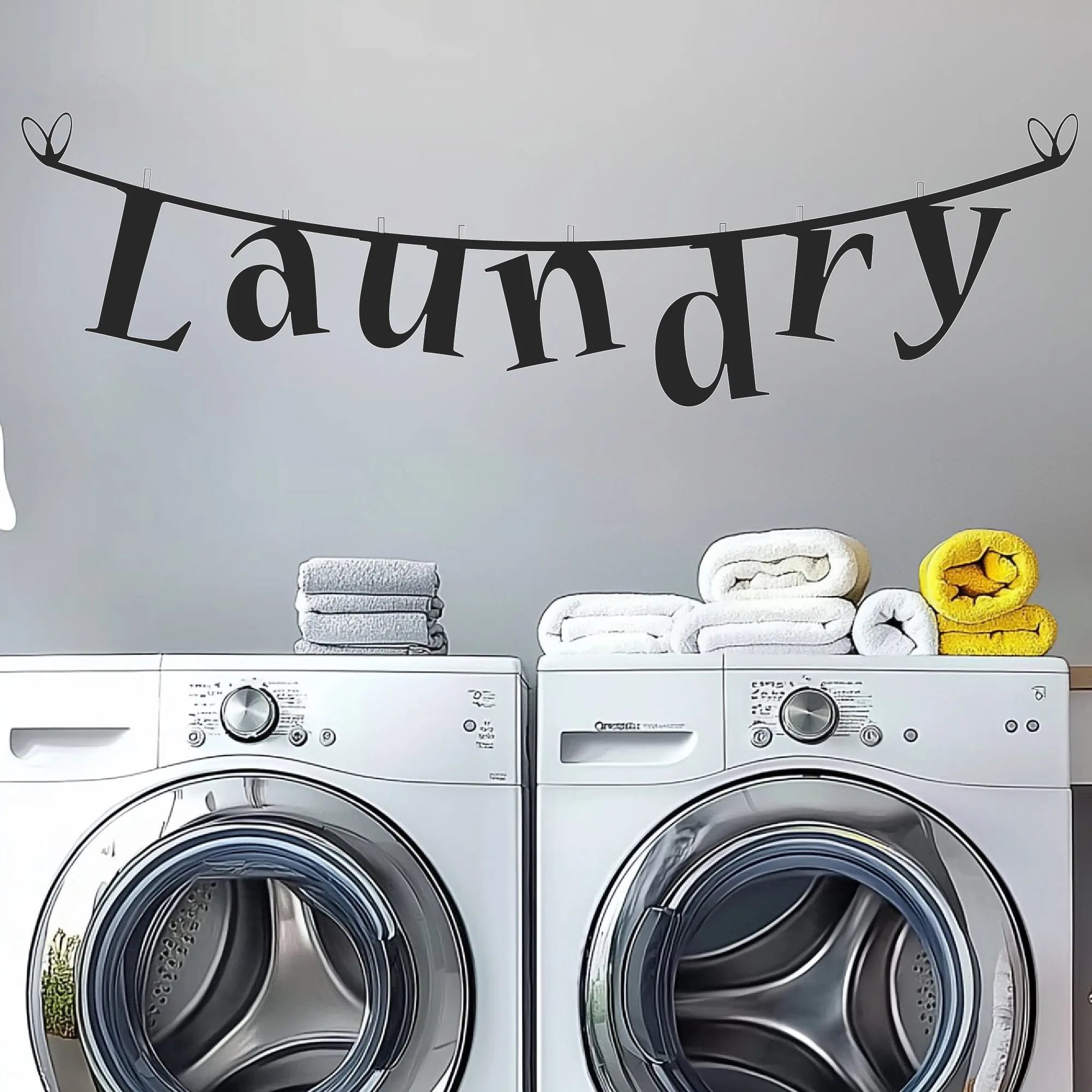 Clothesline laundry room wall decal with whimsical hanging-letter design
