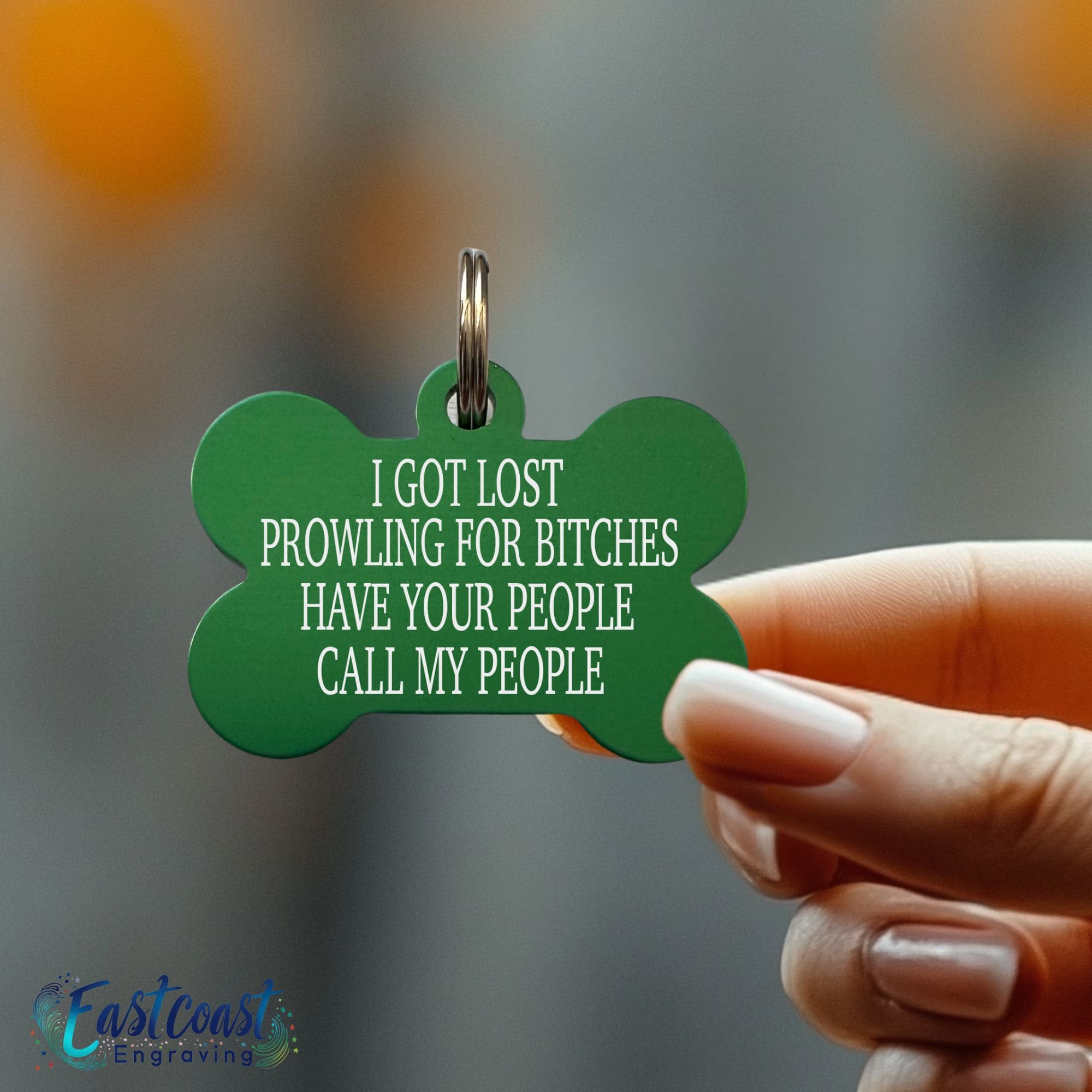Custom dog collar tag with humorous "Prowling for Bitches" engraving