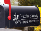 Black mailbox with floral decal featuring personalized family name