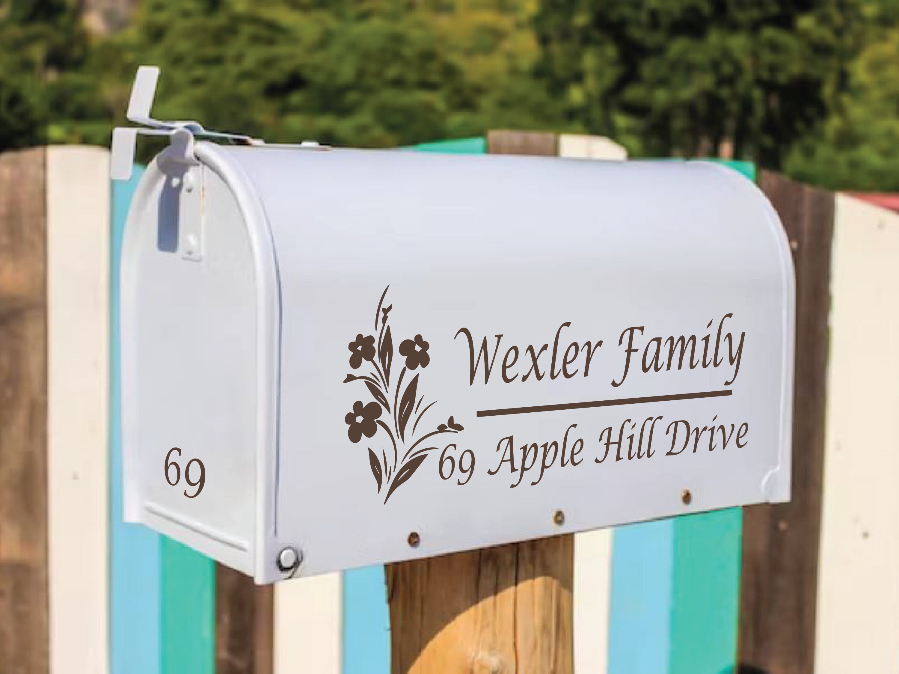 Floral mailbox decal on white mailbox with family name and address