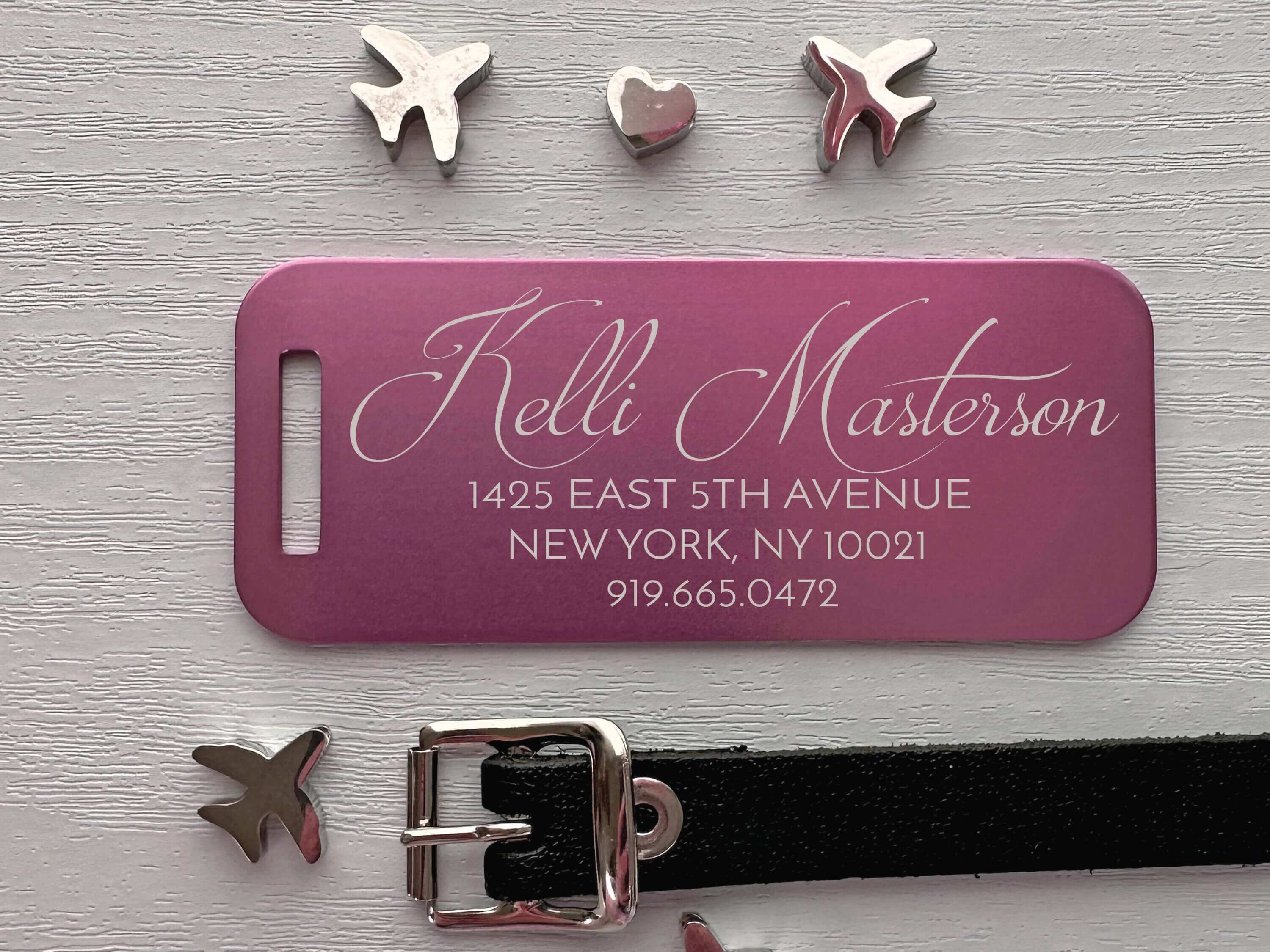 Pink personalized luggage tag with engraved script name for travel and gift use