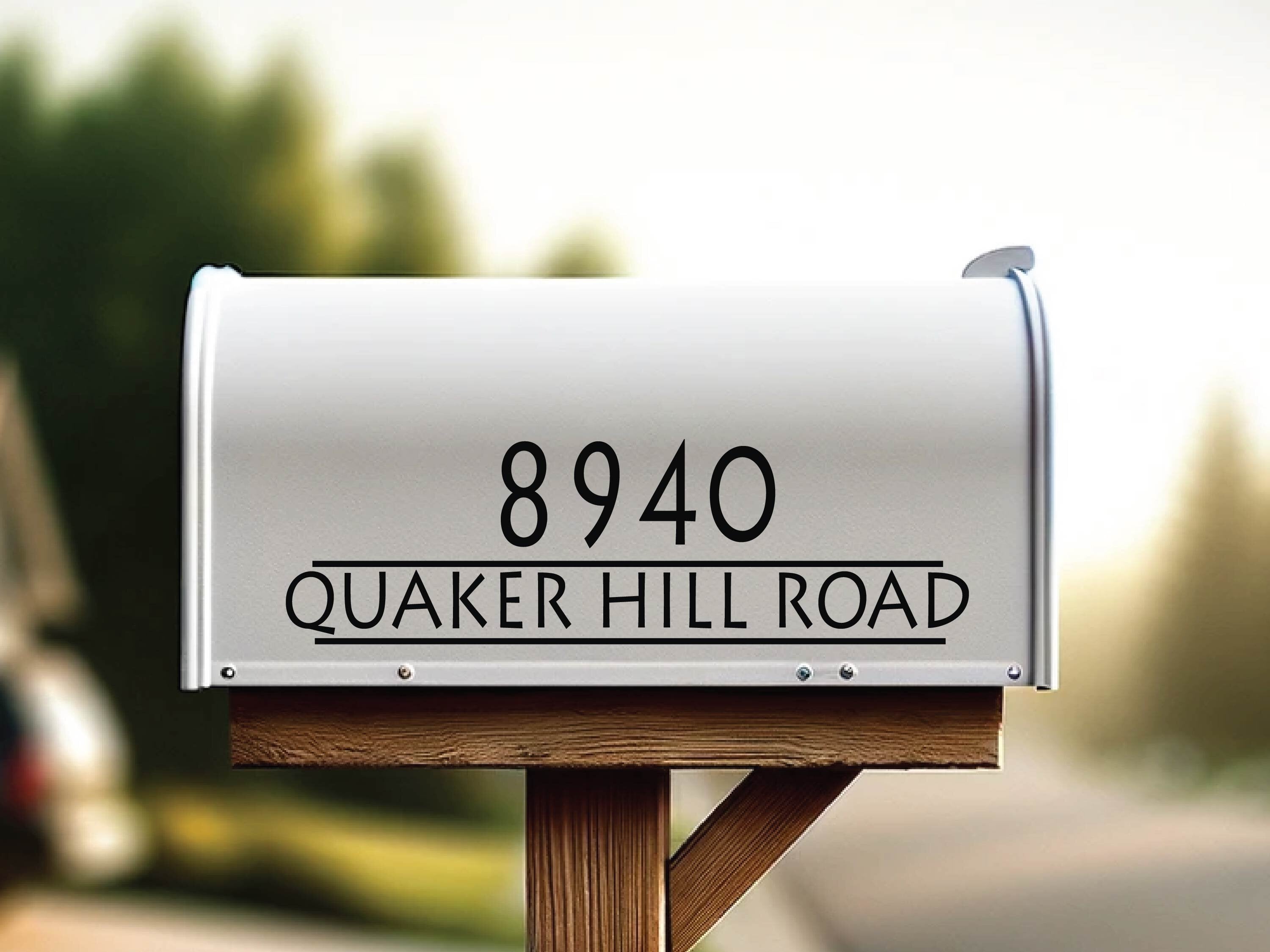 modern vinyl street name decal applied to metal mailbox