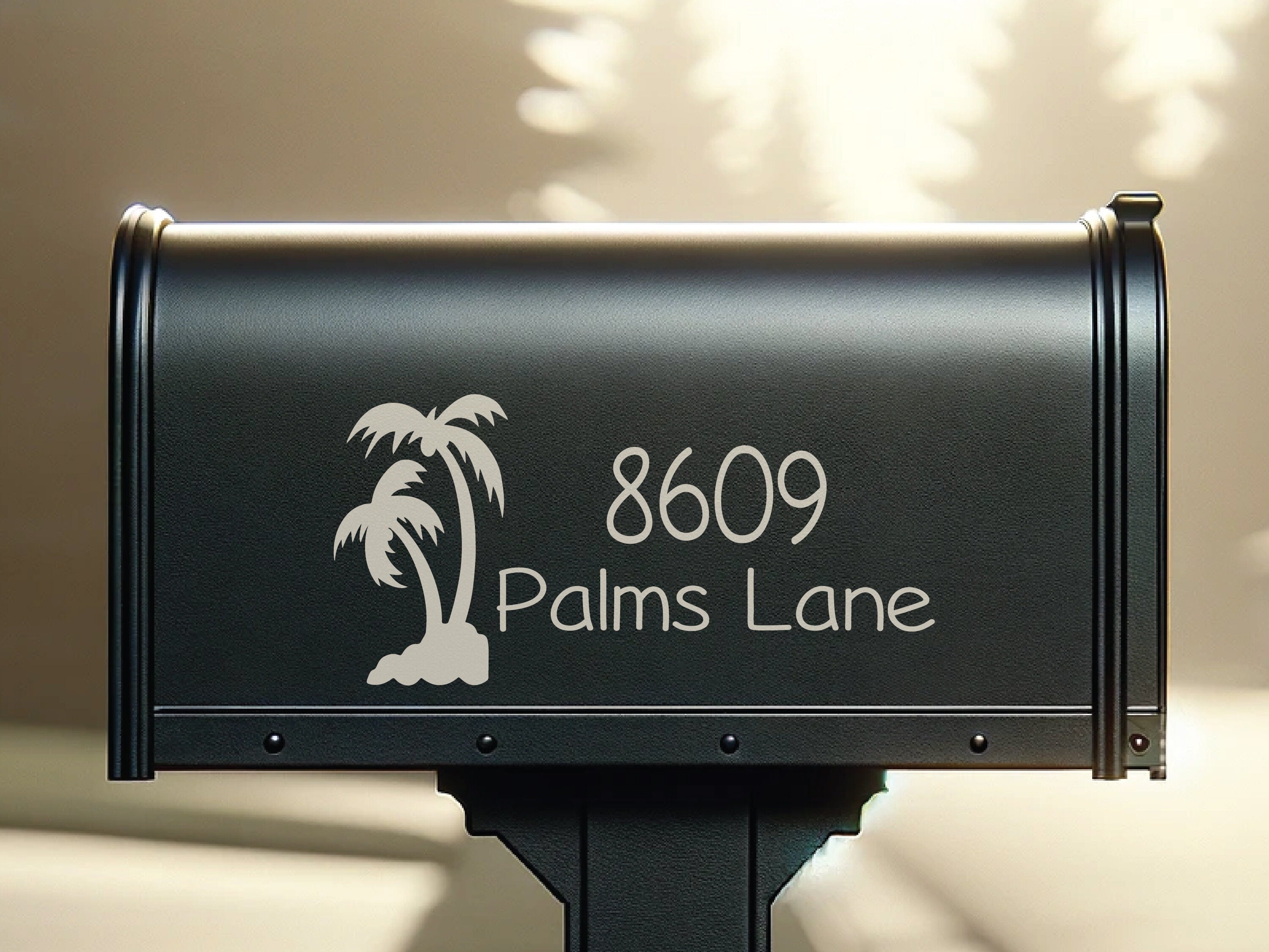 Custom palm tree vinyl decal on black mailbox with beach house number.