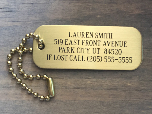 ersonalized brass luggage tag with engraved lettering and brass ball chain
