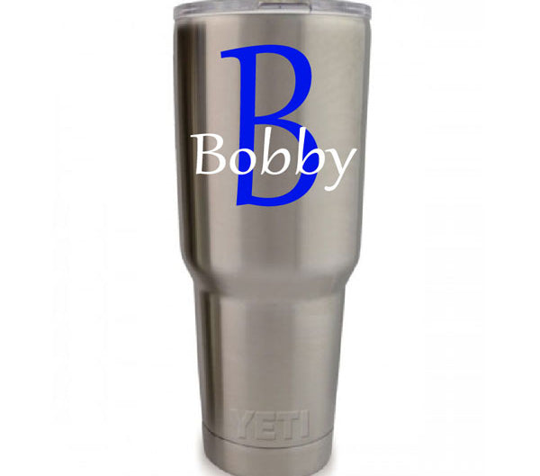 Personalized vinyl monogram decal with print-style initial and name for tumblers and flat surfaces.