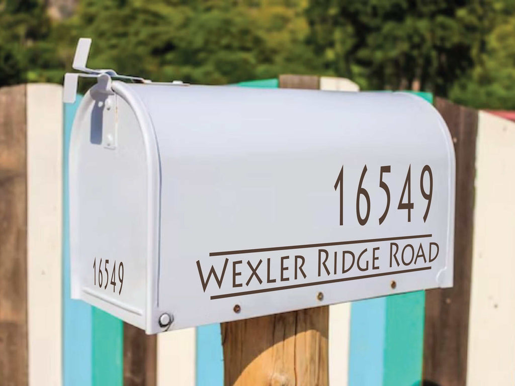 Custom mailbox lettering on a sleek white mailbox enhancing curb appeal
