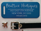 Blue aluminum luggage tag personalized with engraved travel info