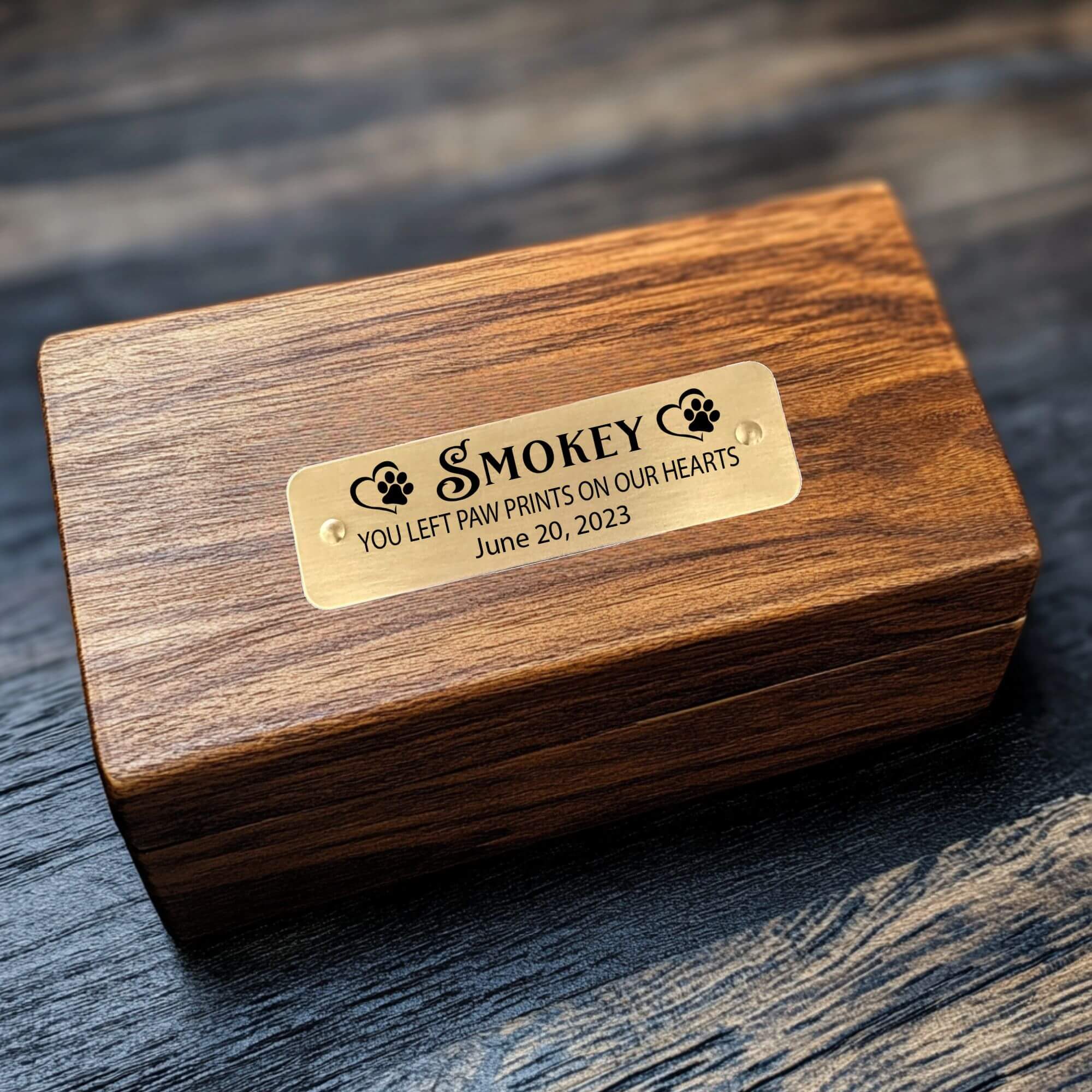 Custom pet memorial plaque with engraved text and self-adhesive backing.