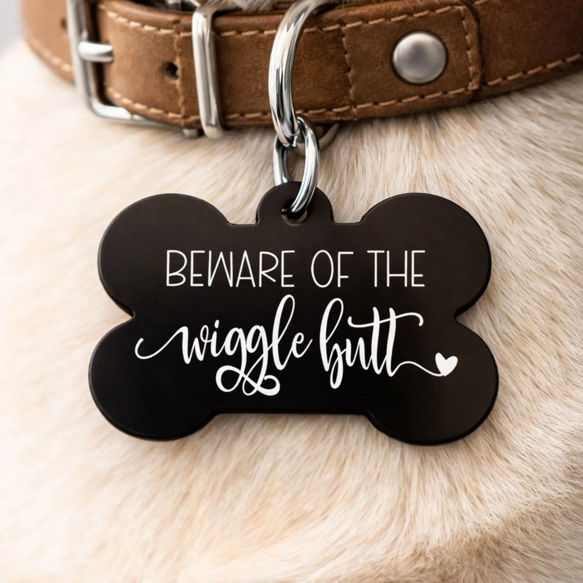 Playful wiggle butt dog ID tag close-up