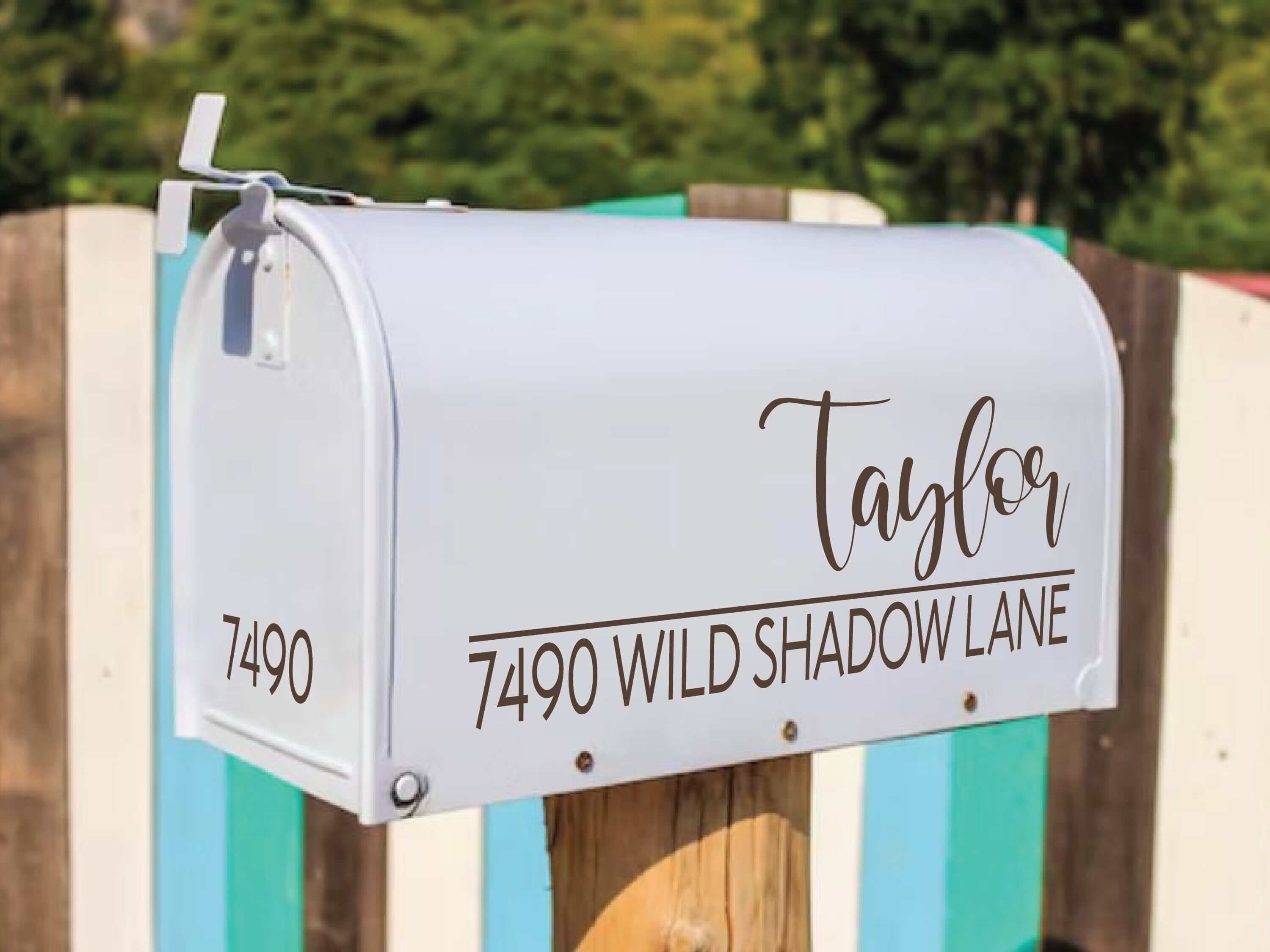 gold vinyl mailbox decal on white mailbox with custom name