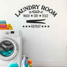 Bold vinyl laundry decal above washer and dryer for modern home decor