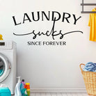 Laundry Sucks wall decal displayed in a laundry room for humorous home decor.