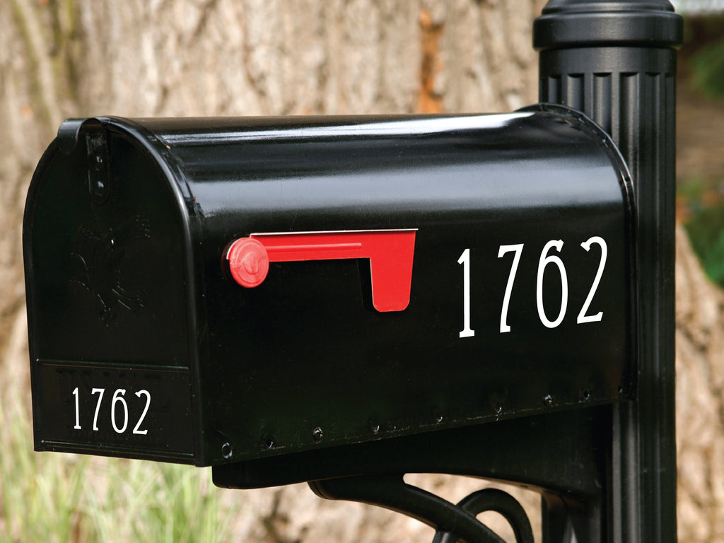 Sleek black mailbox with contrasting white custom mailbox numbers for clear visibility.