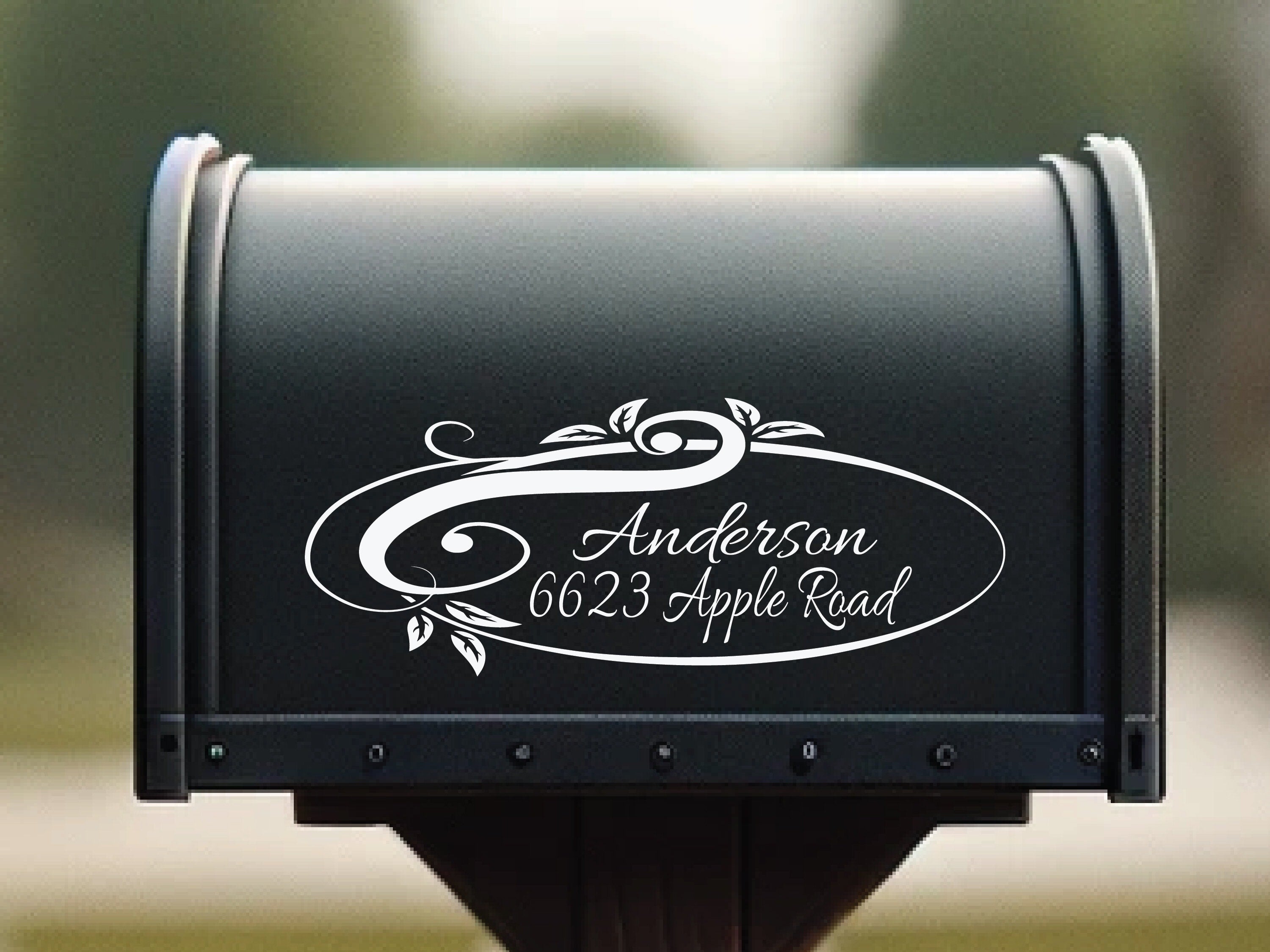 Ornamental vinyl mailbox address sticker on black mailbox