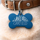 Personalized dog name tag with decorative floral design and custom pet name engraved on a bone-shaped ID tag