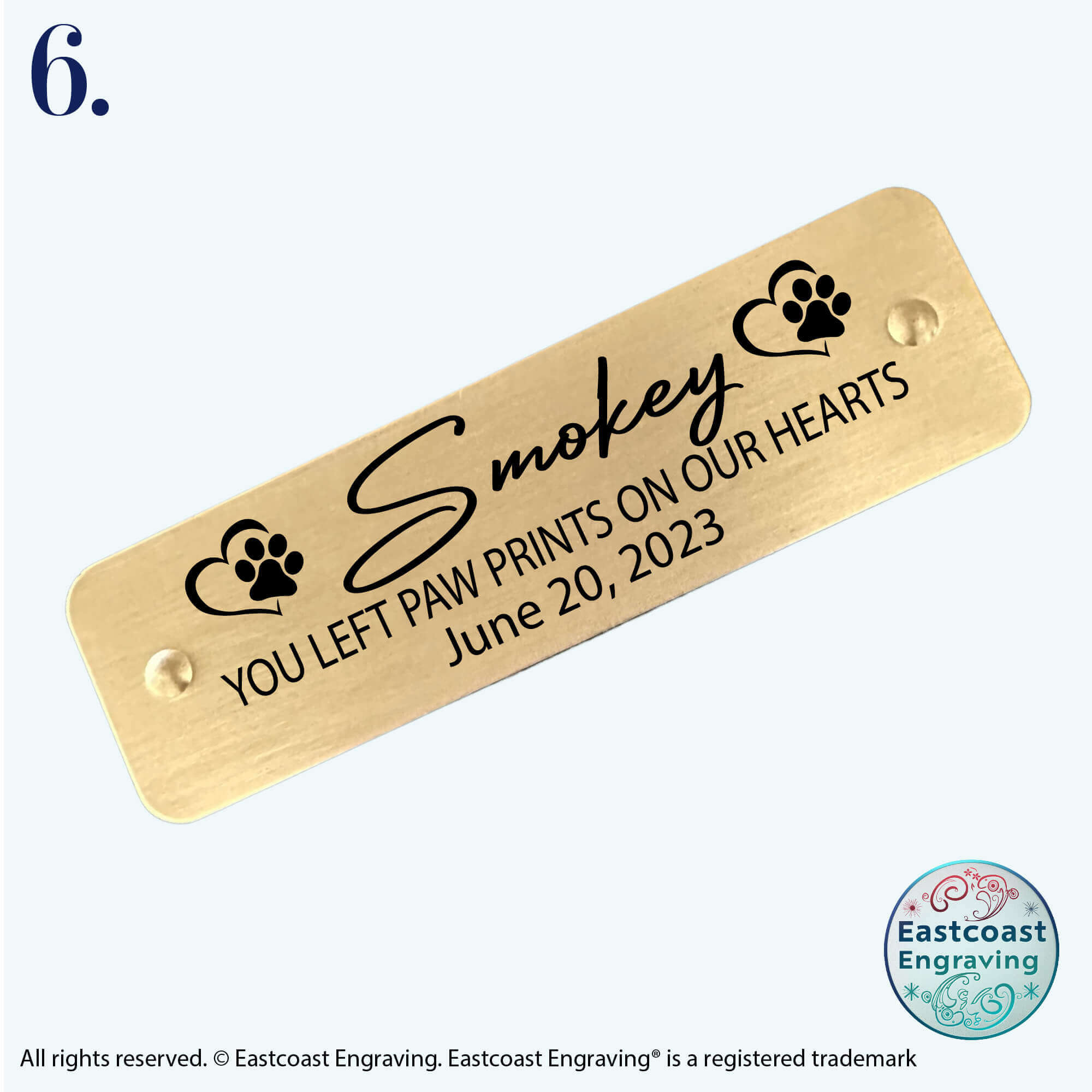 Personalized brass pet memorial tag, self-adhesive for easy application.