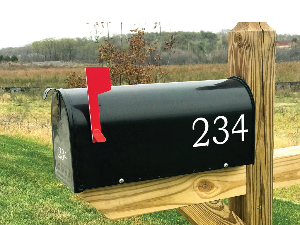 Black mailbox with red flag and white reflective number 234 decals