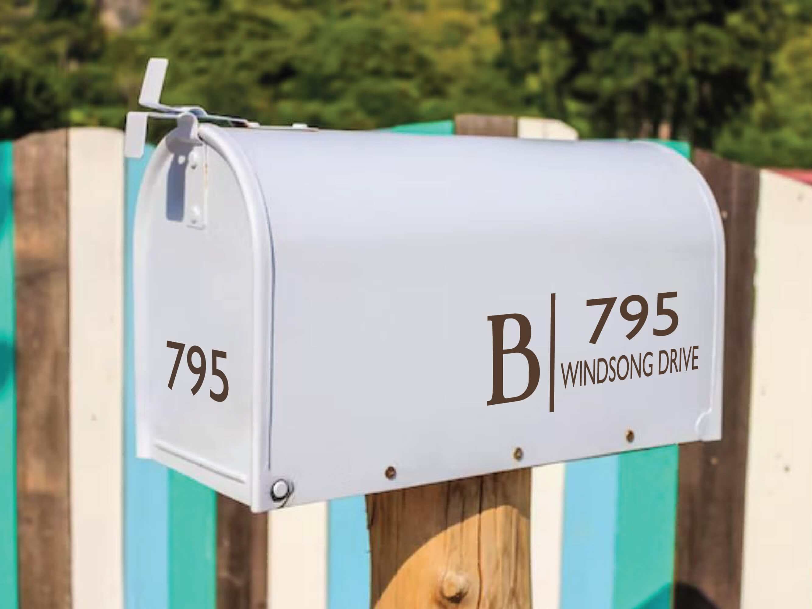 Outdoor mailbox with personalized vinyl letter and address