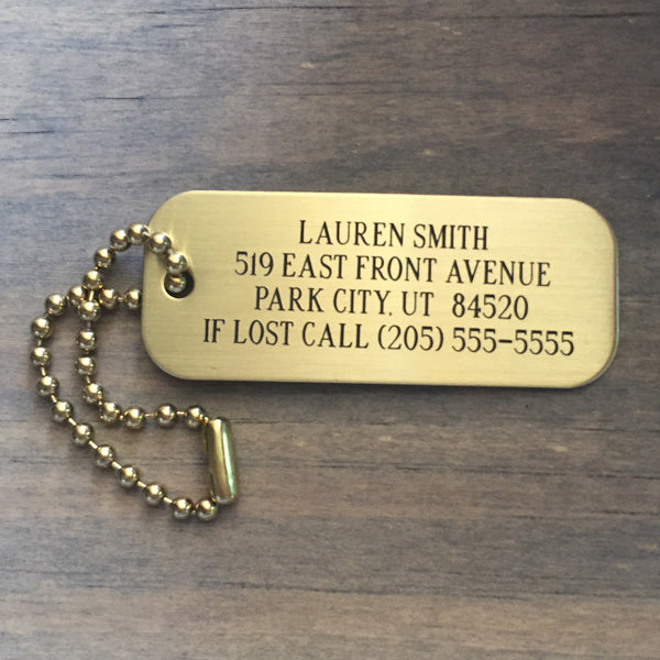 ersonalized brass luggage tag with engraved lettering and brass ball chain